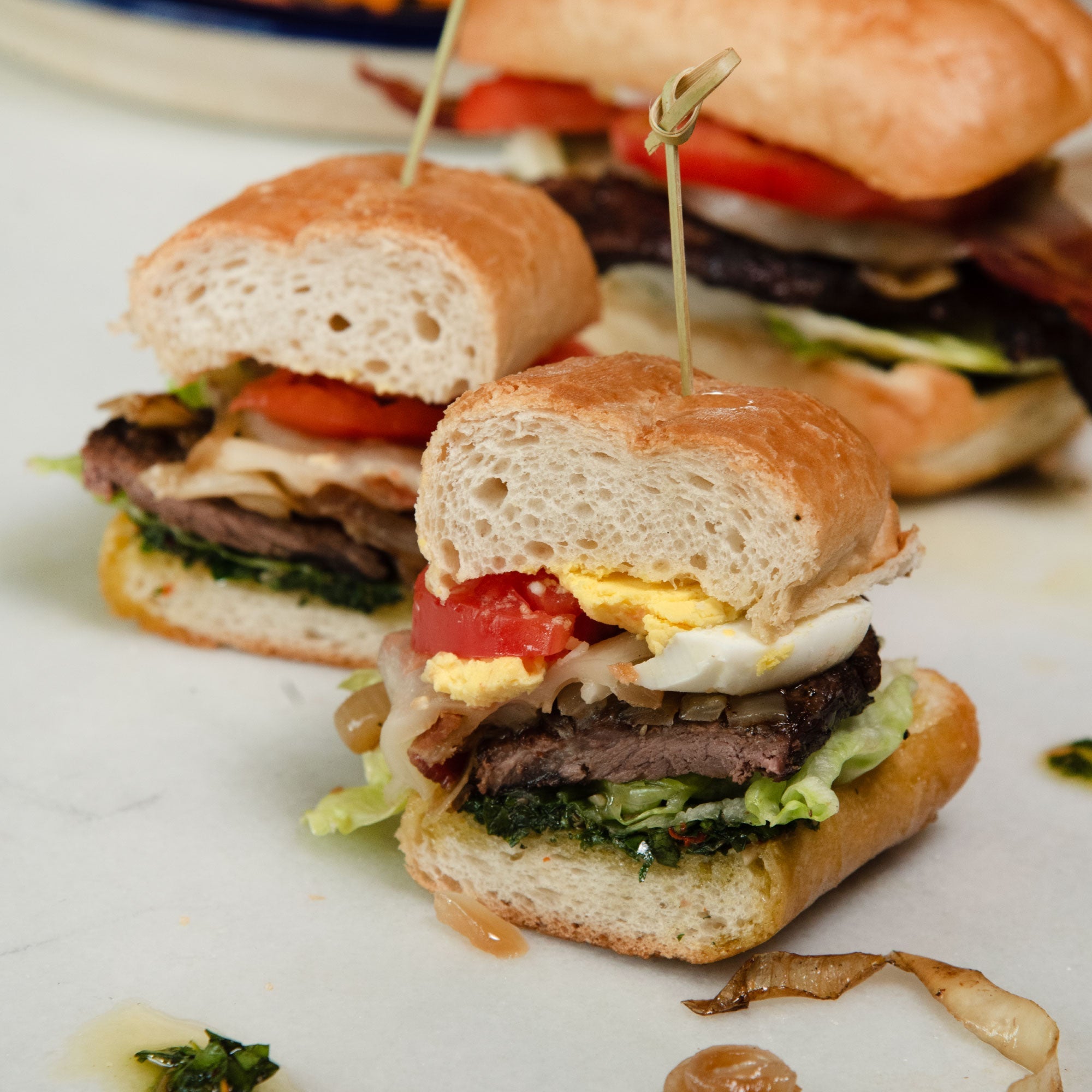 Chivito Steak Sandwich with Grilled Onions