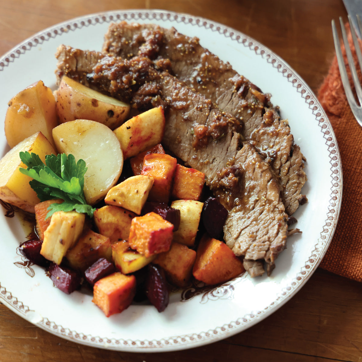 Cider-Braised Brisket with Roasted Root Vegetables and Rosemary-Fig Glaze